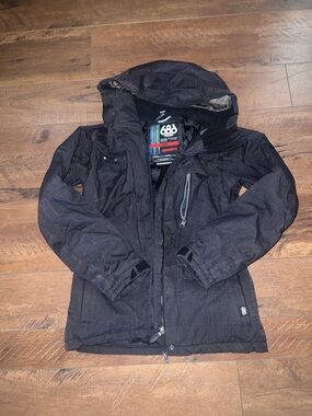686 Women’s Black Hooded Snow Jacket with Zippered Chest Pocket